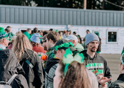 Participants wearing shamrock headbands and green St. Patrick’s Day accessories at the 2025 Poulsbo Beer Run.