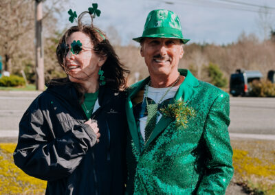 Participant wearing a bright green sequined jacket and hat at the 2025 Poulsbo Beer Run event.