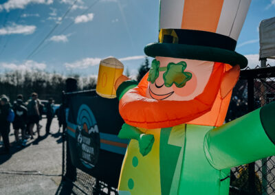 Large inflatable leprechaun decoration at the entrance of the 2025 Poulsbo Beer Run event.