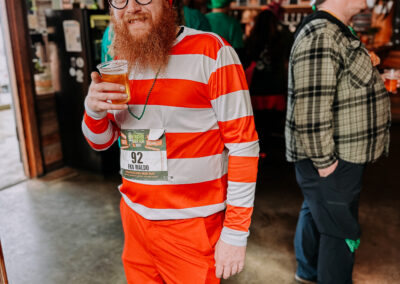 Participant dressed as Where’s Waldo holding a drink at the 2025 Poulsbo Beer Run in Poulsbo, Washington.
